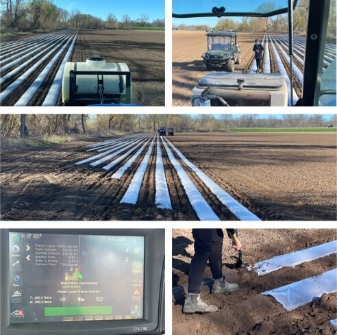 Tractor preparing field with plastic mulch.